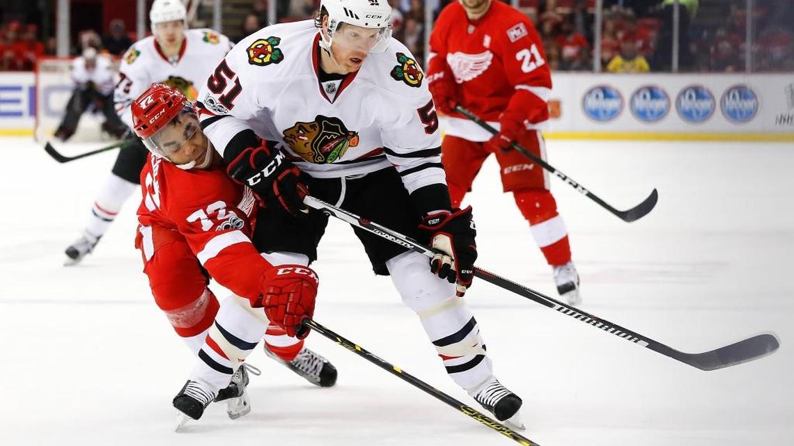 Chicago defenseman Brian Campbell — who left the Panthers to return to the Blackhawks after five seasons this past summer — works the puck around Detroit’s Andreas Athanasiou earlier this month.