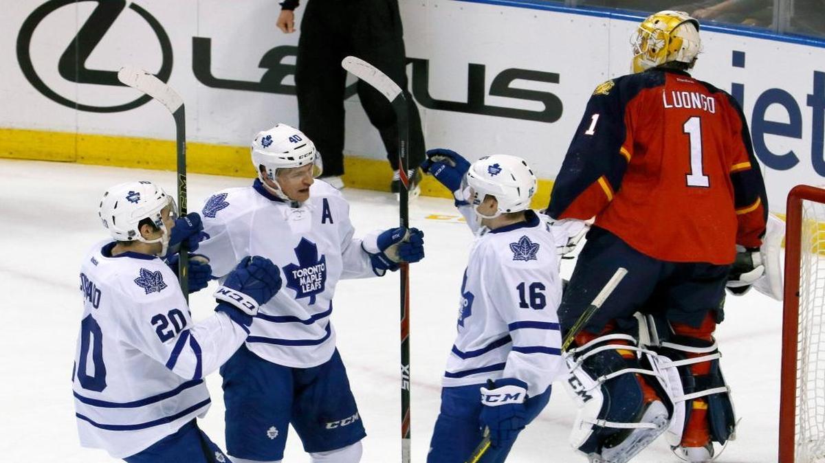 Toronto Maple Leafs right wing Michael Grabner (40) celebrates his score against Florida Panthers goalie Roberto Luongo (1) with teammates Frank Corrado (20) and Connor Brown (16) in the first period of an NHL hockey game Tuesday, March 29, 2016, in Sunrise, Fla.