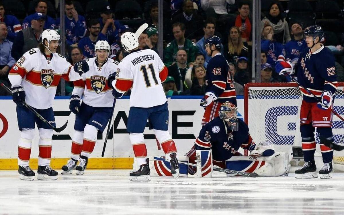 Florida Panthers left wing Jonathan Huberdeau (11) is congratulated by Panthers center Aleksander Barkov (16) and Panthers right wing Jaromir Jagr (68) after scoring a goal past New York Rangers goalie Antti Raanta (32) during the second period of an NHL hockey game, Fri., March 17, 2017, in New York.