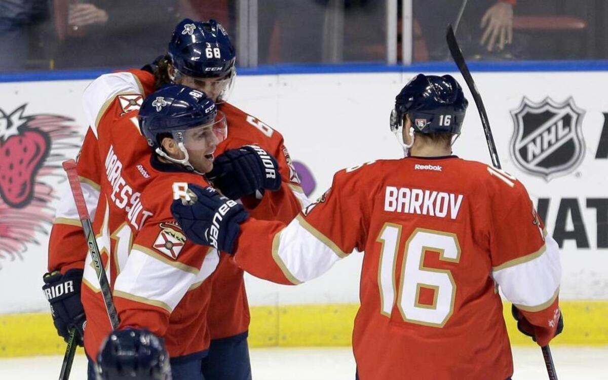 Florida’s Jonathan Marchessault is congratulated by Jaromir Jagr (68) and Sasha Barkov after scoring in the first period Thursday night.
