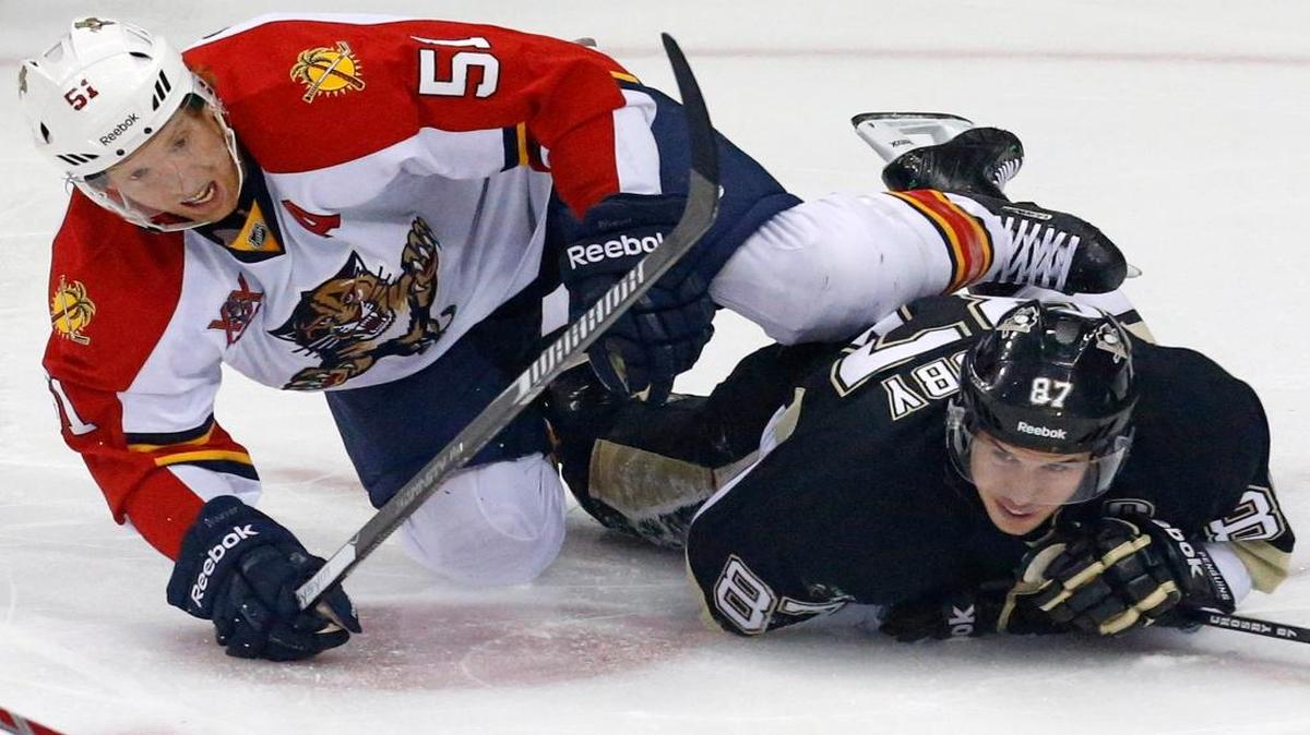 
Florida Panthers’ Brian Campbell (51) collides with Pittsburgh Penguins’ Sidney Crosby (87) during a game in Pittsburgh, Monday, Jan. 20, 2014.
