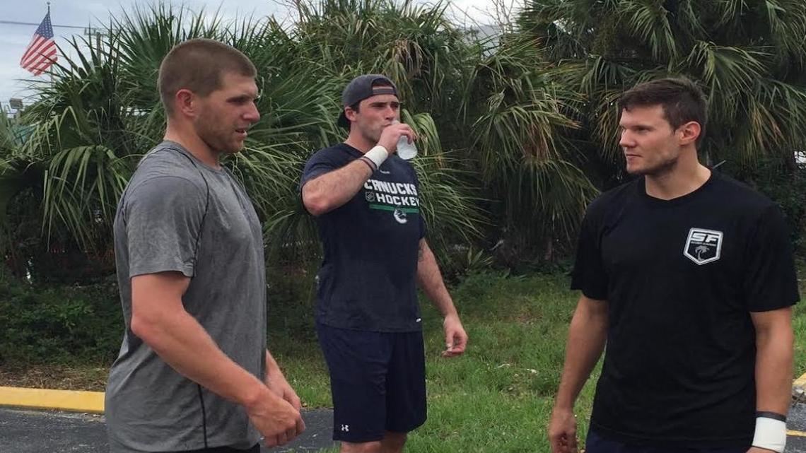 Steven Kampfer, left, Erik Gudbranson and Dmitry Kulikov get ready to run at the South Florida Hockey Academy in Lighthouse Point.