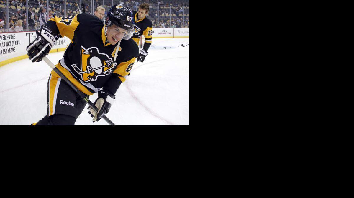 
Pittsburgh Penguins' Sidney Crosby (87) warms up before an NHL hockey game against the Colorado Avalance in Pittsburgh on Dec. 18, 2014.
