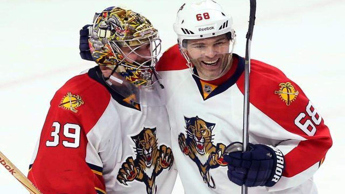 
Jaromir Jagr, right, and goalie Dan Ellis celebrate after the Panthers’ victory. 
