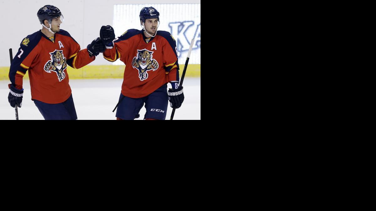 
Florida Panthers center Dave Bolland (63) is congratulated by teammate Dmitry Kulikov (7) after Bolland scored against the Dallas Stars in the second period of an NHL hockey preseason game, in Sunrise, Fla., Wednesday, Sept. 24, 2014. 
