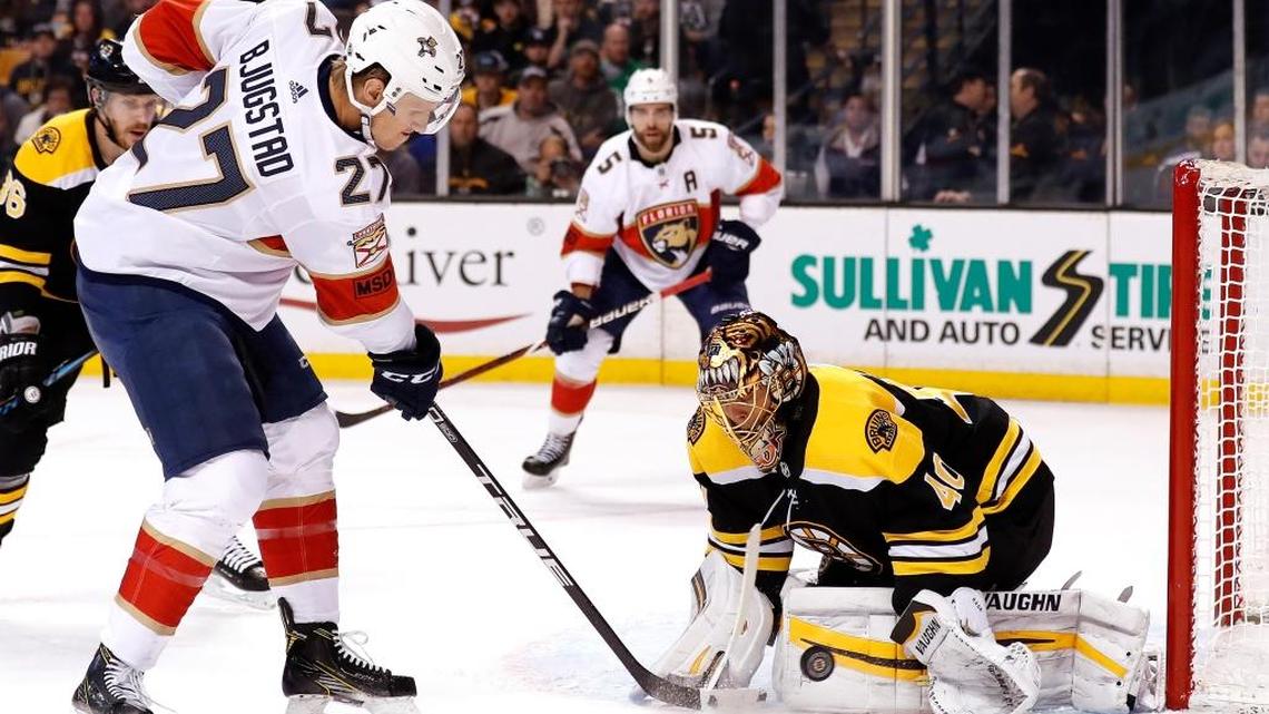 Florida Panthers' Nick Bjugstad tries to knock a rebound past Boston Bruins goaltender Tuukka Rask during the first period of an NHL hockey game in Boston Sun., April 8, 2018.