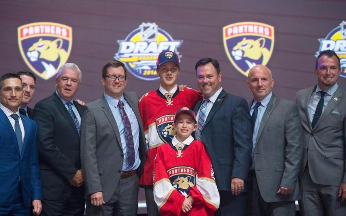 Henrik Borgstrom, center, stands on stage with members of the Florida Panthers management team at the NHL Draft, Fri., June 24, 2016, in Buffalo, N.Y.