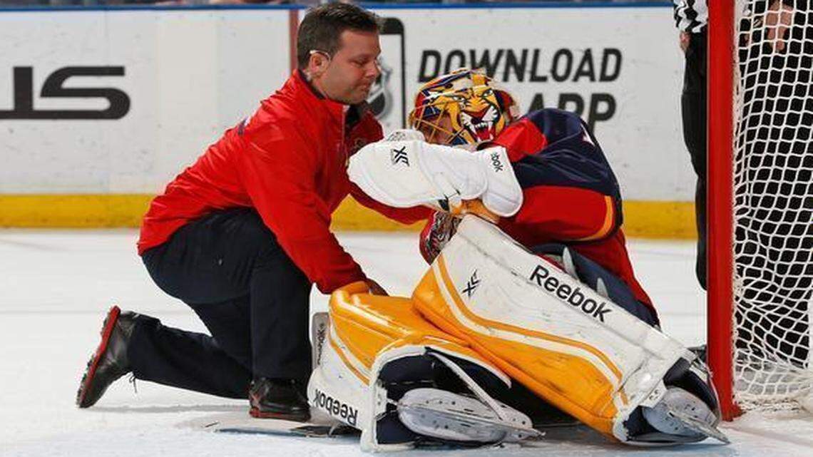 
Goaltender Roberto Luongo of the Florida Panthers is checked by a team trainer after being injured during first-period action against the Toronto Maple Leafs at the BB&T Center on March 3, 2015 in Sunrise, Florida.
