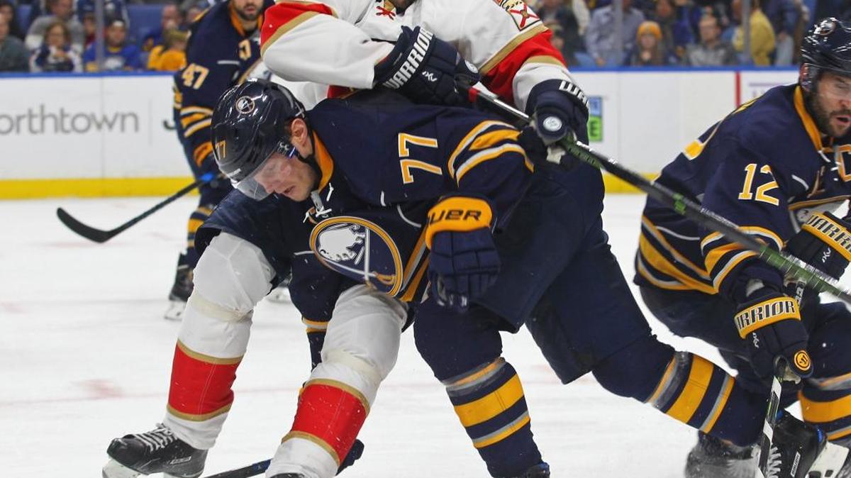 Buffalo defenseman Dmitry Kulikov takes on former teammate Jaromir Jagr on Oct. 29.