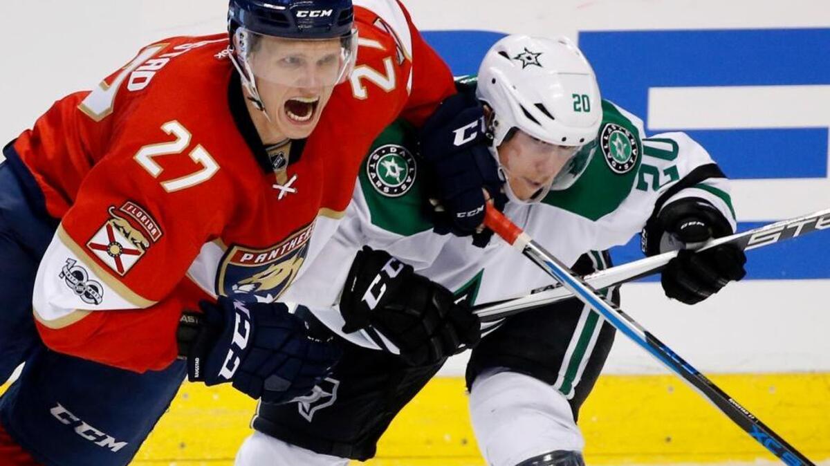 Florida center Nick Bjugstad battles Cody Eakin of the Dallas Stars on Saturday night in Sunrise.