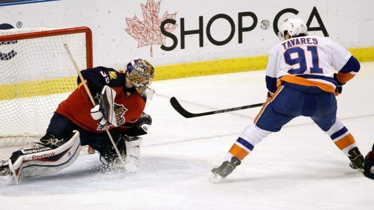
New York Islanders’ John Tavares (91) attempts a shot on Florida Panthers goalie Dan Ellis during the second period of an NHL hockey game at the BB&T Center in Sunrise on March 7, 2015.
