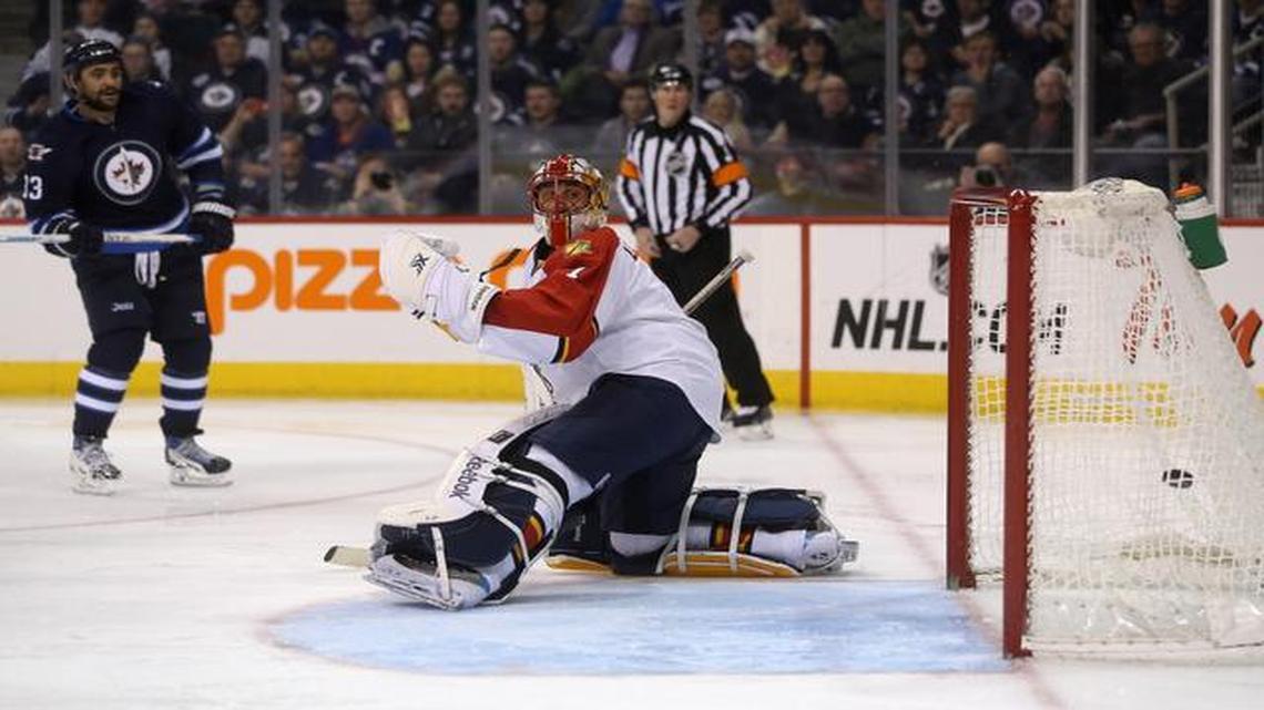 
Winnipeg Jets' Dustin Byfuglien (33) scores on Florida Panthers goaltender Roberto Luongo (1) during the second period of an NHL hockey game Tuesday, Jan. 13, 2015, in Winnipeg, Manitoba. 

