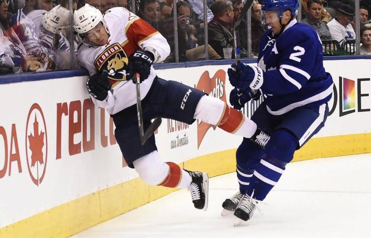 Florida’s Jonathan Marchessault ends up in the boards after being run by Toronto defenseman Matt Hunwick during the first period of the Maple Leafs win Thursday night.