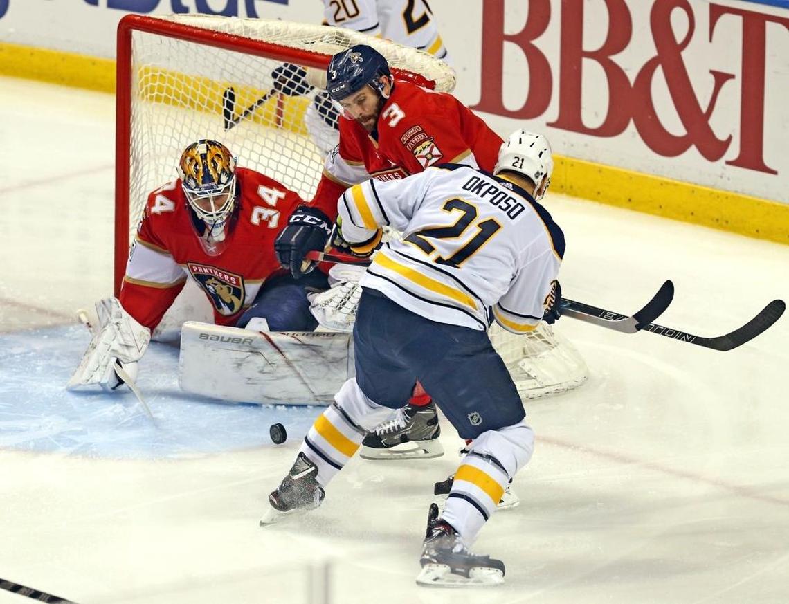 Florida Panthers goalie James Reimer (34) and Keith Yandle (3) defend against Buffalo Sabres’ Kyle Okposo (3) goal attempt in the first period Saturday, April 7, 2018, at the BB&T Center in Sunrise, Fla.