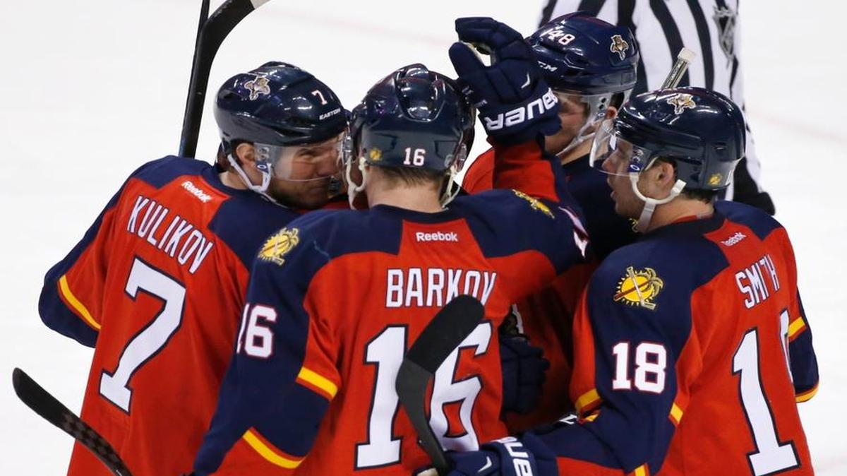 Teammates congratulate Florida Panthers center Aleksander Barkov (16) after he scored a goal during the second period of an NHL hockey game against the Arizona Coyotes, Thursday, Feb. 25, 2016 in Sunrise, Fla.