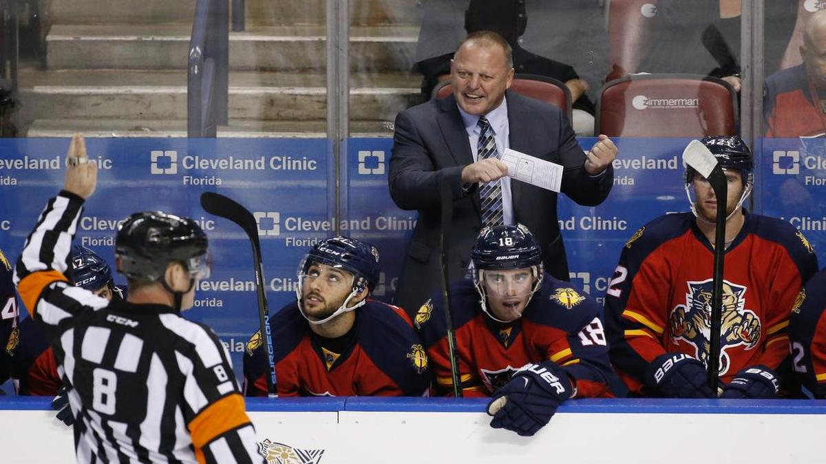 Florida Panthers head coach Gerard Gallant, center rear, argues a call with referee Dave Jackson (8) during the second period of an NHL hockey game against the Los Angeles Kings, Monday, Nov. 23, 2015 in Sunrise, Fla.
