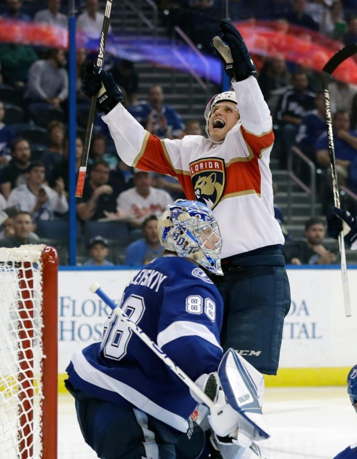 Florida Panthers center Nick Bjugstad (27) celebrates in front of Tampa Bay Lightning goaltender Andrei Vasilevskiy, (88), of Russia, after scoring during the third period of an NHL hockey game Tuesday, March 6, 2018, in Tampa, Fla. The Lightning won the game 4-3 in overtime.