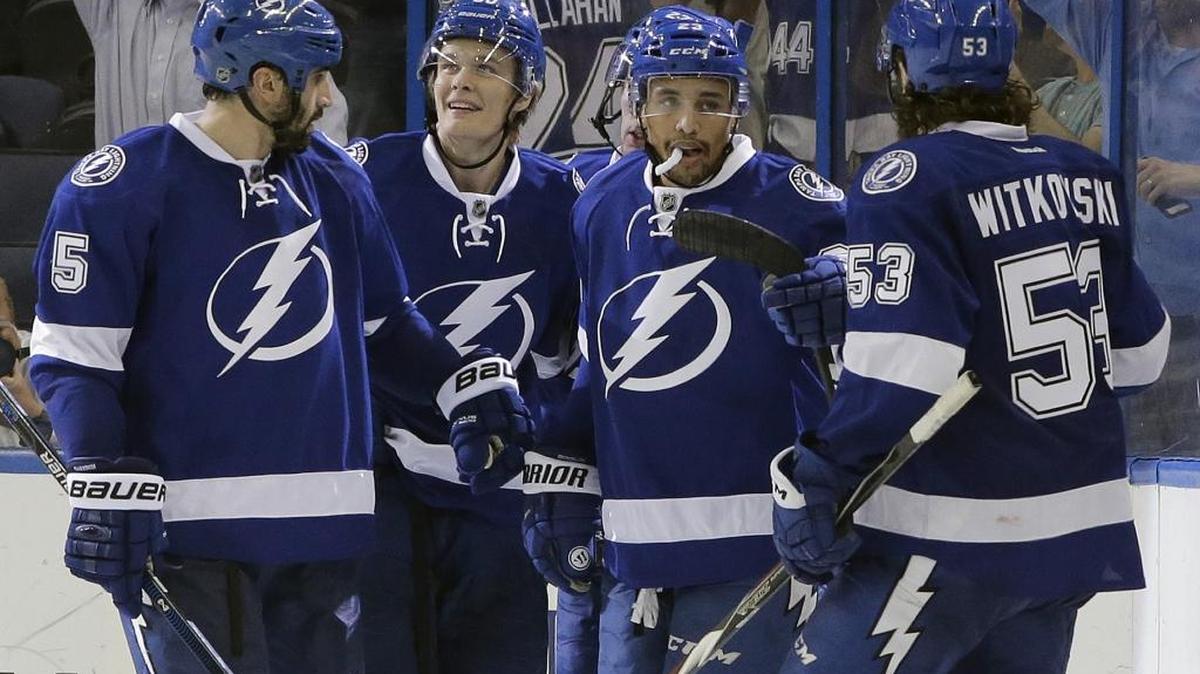 
Tampa Bay Lightning right wing J.T. Brown, second from right, celebrates with Jason Garrison, left, Vladislav Namestnikov, second from left, and Luke Witkowski, right, after scoring against the Dallas Stars during the third period of an NHL preseason game Thursday, Oct. 1, 2015, in Tampa, Fla. 
