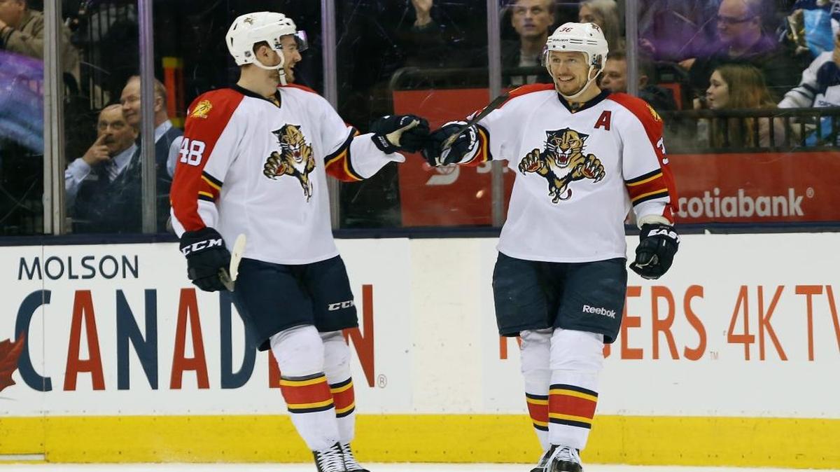 Florida Panthers' Logan Shaw (48) and Jussi Jokinen (36) celebrate a goal by Jokinen during the second period of an NHL hockey game Thursday, March 17, 2016, in Toronto.