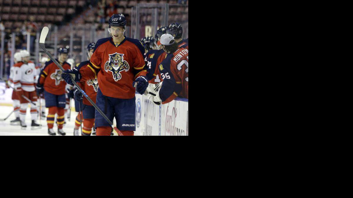
Florida Panthers center Nick Bjugstad (27) smiles after scoring a goal in the first period against the Carolina Hurricanes, Wednesday, Nov. 26, 2014, in Sunrise, Fla. 
