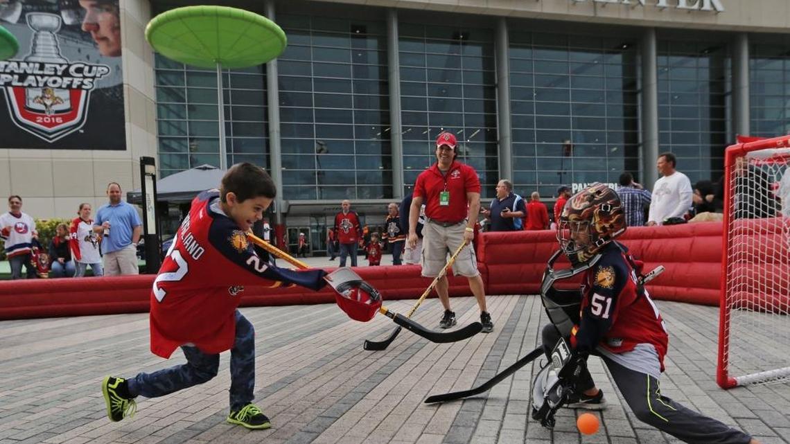 J. Cirigliano, 10, goes up against goalie Jason Feinstein, 9, before the start of a Panthers game in April.