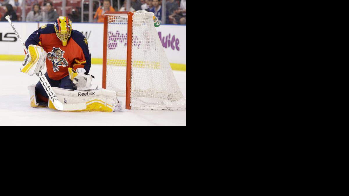 
Florida Panthers goalie Roberto Luongo makes a save against the Tampa Bay Lightning, Saturday, April 4, 2015 in Sunrise, Fla. 
