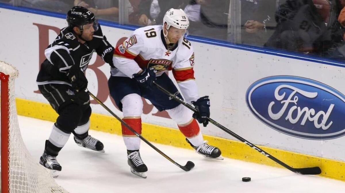 Michael Matheson battles Los Angeles’ Alec Martinez during the second period of Thursday’s game in Sunrise.