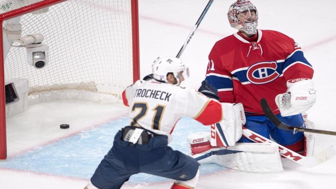 Florida Panthers center Vincent Trocheck (21) celebrates after Montreal Canadiens goalie Carey Price (31) lets in the winning goal during overtime in an NHL hockey game, Tues., Nov. 15, 2016 in Montreal.
