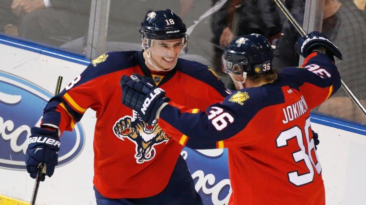 The Panthers’ Reilly Smith, left, celebrates with Jussi Jokinen after Jokinen scored against the Bruins last week. The line of Smith, Jokinen and Vincent Trochek has contributed consistent scoring for Florida this season.
