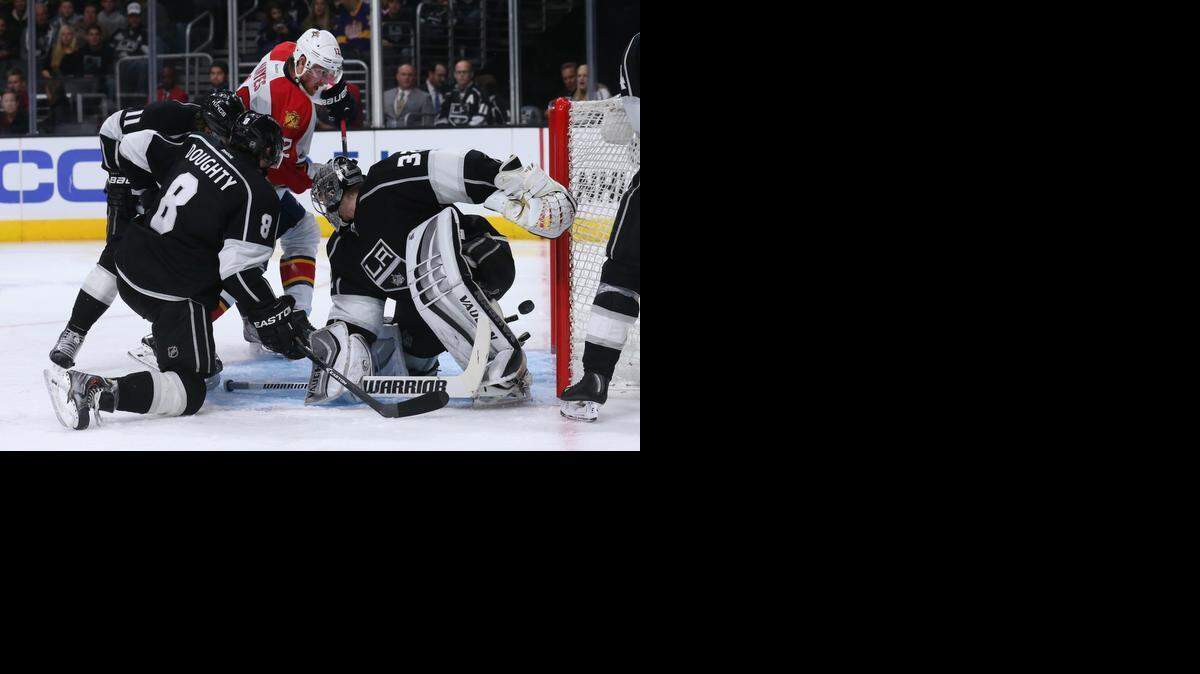 
The Panthers’ Jimmy Hayes beats goalie Jonathan Quick and Drew Doughty at Staples Center on Nov. 18, 2014 in Los Angeles. The Kings won 5-2. 
