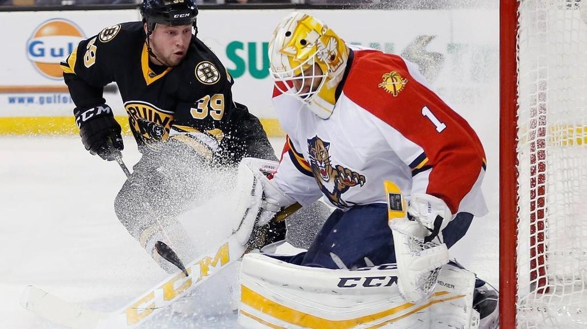 Boston Bruins' Matt Beleskey (39) looks for the rebound off Florida Panthers' Roberto Luongo (1) during the second period of an NHL hockey game in Boston, Saturday, Dec. 12, 2015.