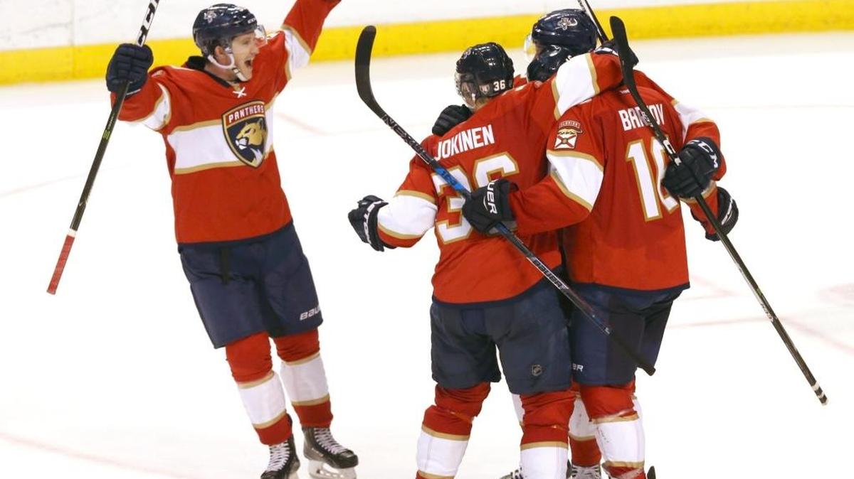 The Florida Panthers celebrate Sasha Barkov’s game-winning goal in overtime against the New Jersey Devils on Opening Night on October 13, 2016.