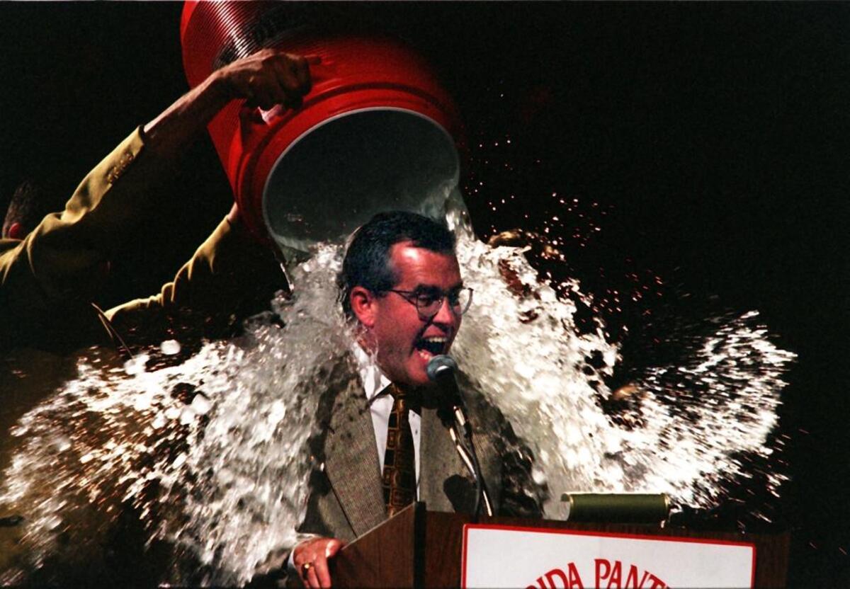 Florida Panthers coach Doug MacLean gets doused by defenseman Ed Jovanovski during the team’s 1996 Stanley Cup Finals celebration at Miami Arena on June 12, 1996.