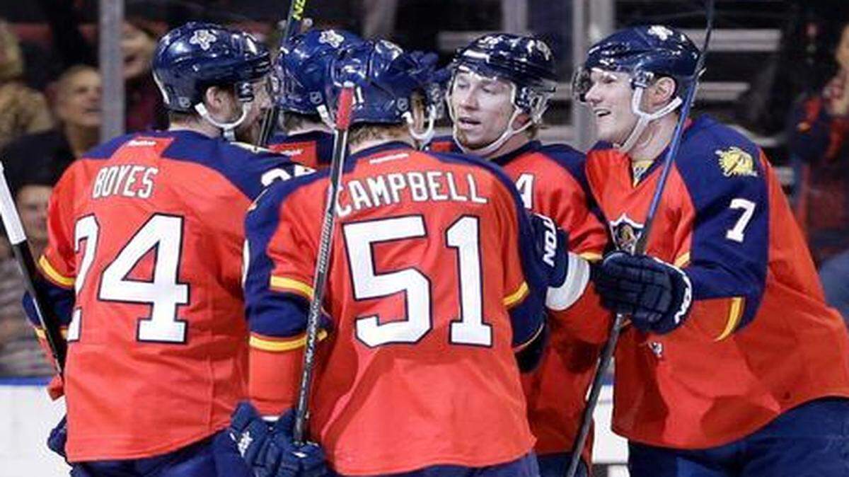 
Florida Panthers defenseman Dmitry Kulikov (7) of Russia, is congratulated by teammates after scoring a goal during the first period against the Anaheim Ducks, Tuesday, Feb. 10, 2015, in Sunrise, Fla. 
