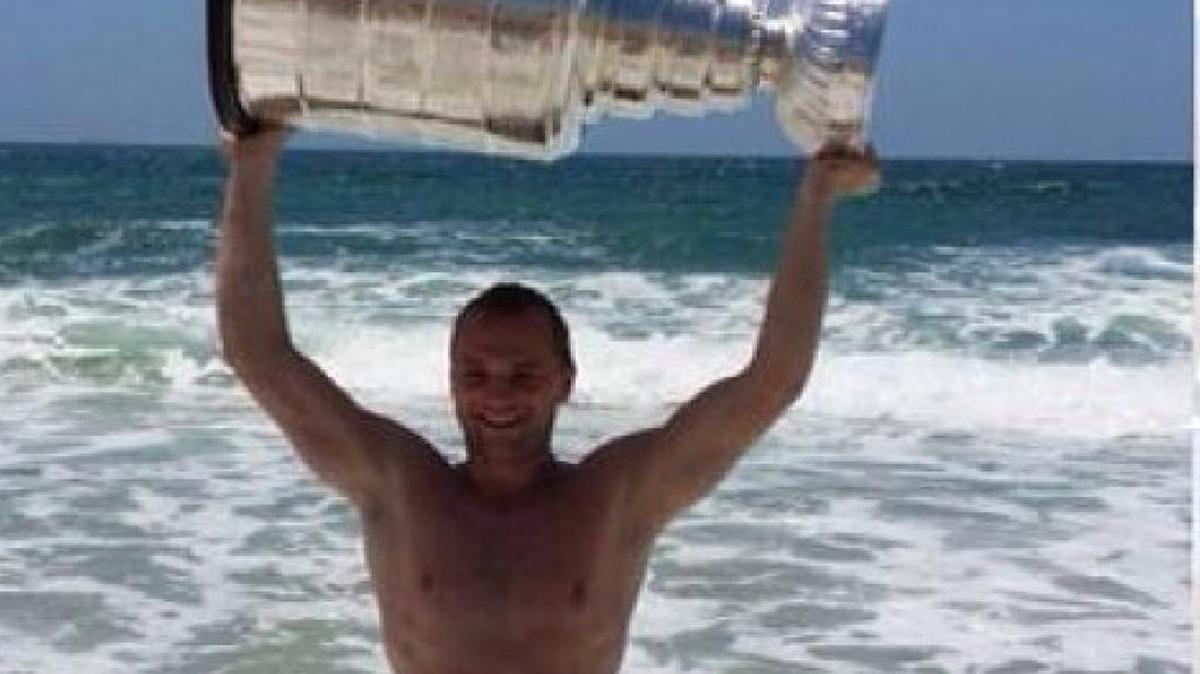 Marian Gaborik celebrates the Los Angeles Kings’ 2014 championship by taking the Stanley Cup to the Pacific Ocean.