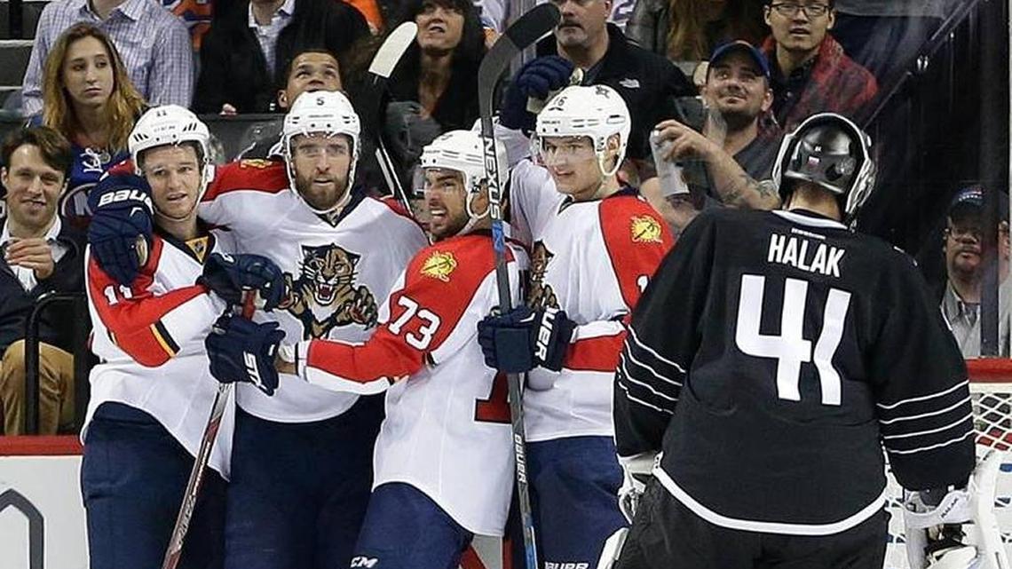 Florida’s Jonathan Huberdeau, Aaron Ekblad, Brandon Pirri celebrate Sasha Barkov’s goal past New York Islanders’ goalie Jaroslav Halak in what turned out to be the first victory of a 12-game winning streak on Dec. 15, 2015.