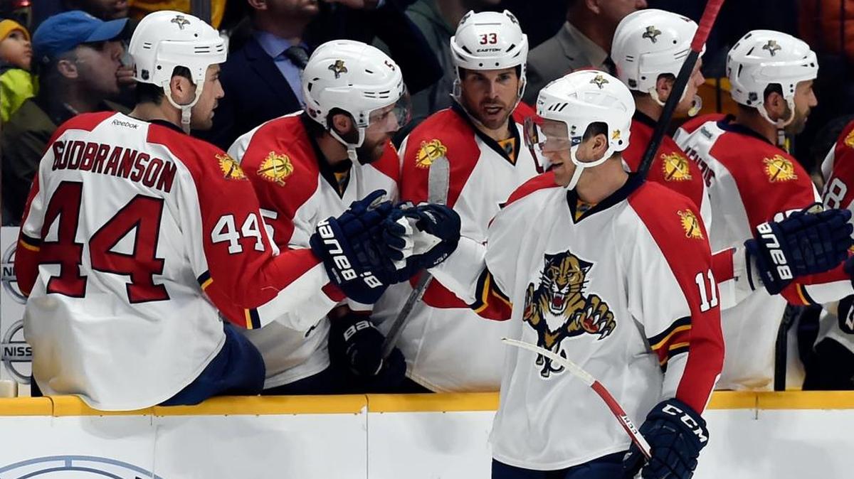 Panthers teammates congratulate Jonathan Huberdeau after he scored a goal against the Predators on Dec. 3, 2015.