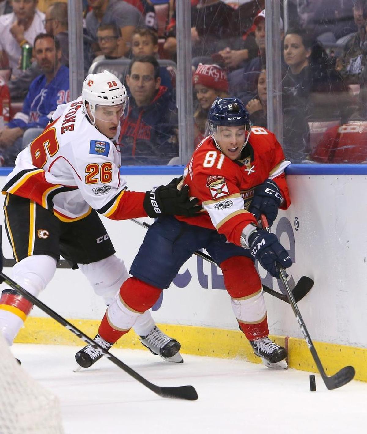 Former Florida Panthers center Jonathan Marchessault fights for the puck against Calgary’s Michael Stone. The Vegas Golden Knights selected Marchessault in the NHL expansion draft Wednesday.