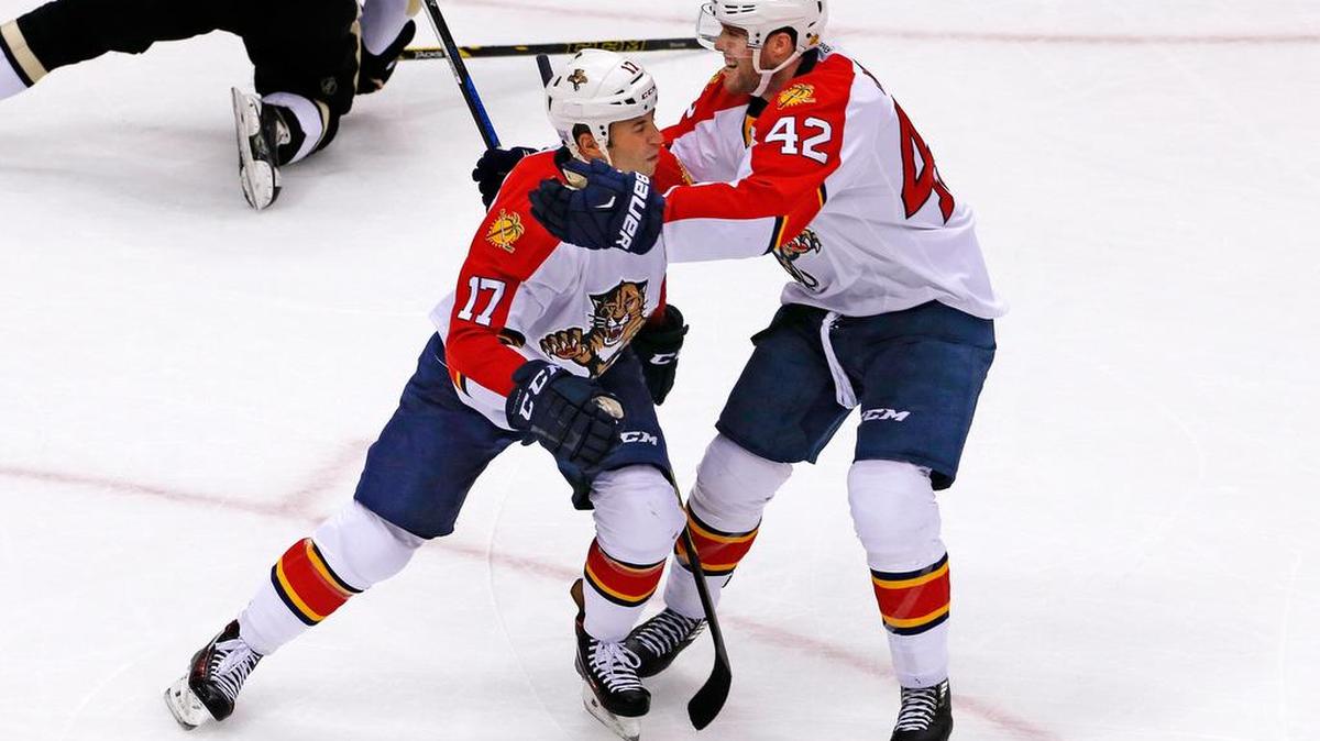 Florida Panthers' Derek MacKenzie (17) celebrates his goal with Quinton Howden (42) in the third period of an NHL hockey game against the Pittsburgh Penguins in Pittsburgh, Tuesday, Oct. 20, 2015. The Penguins won in overtime, 3-2.
