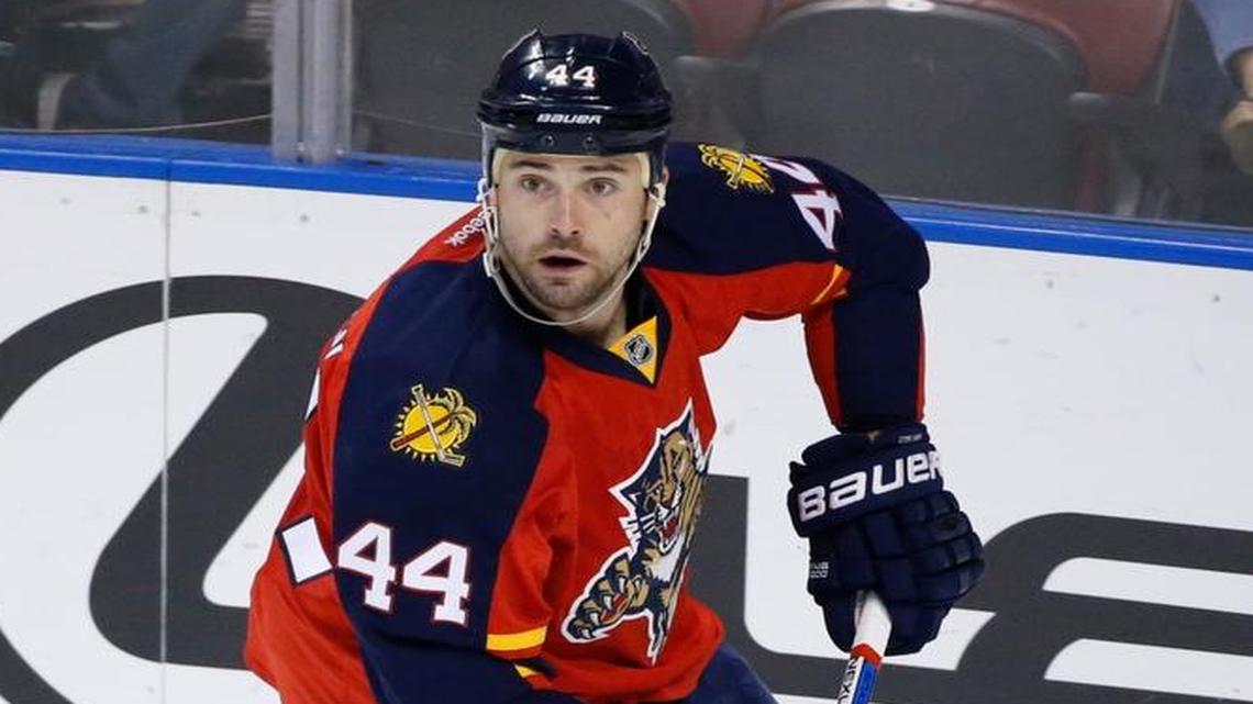 Panthers defenseman Erik Gudbranson skates with the puck during the first period of an NHL hockey game against the Ottawa Senators in Sunrise, Fla. The Panthers and Gudbranson have agreed on a one-year contract, the team announced Mon., May 9, 2016.