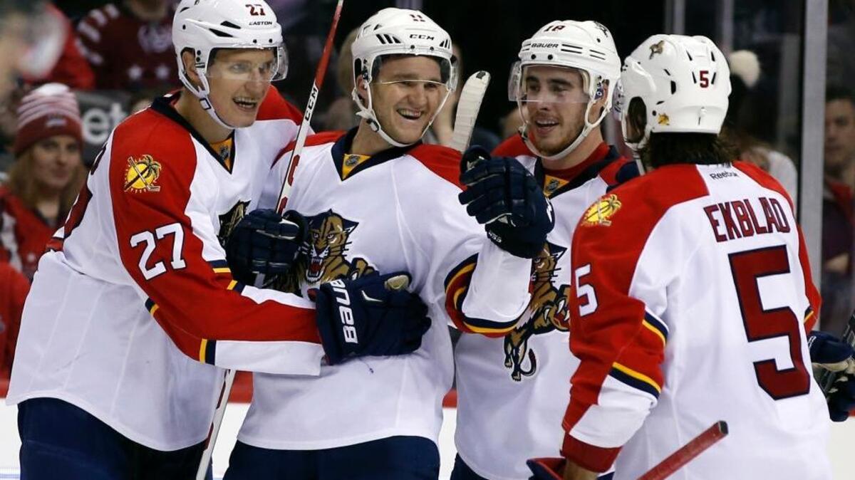 Jonathan Huberdeau, center, celebrates a goal with teammates Nick Bjugstad (27), Reilly Smith (18) and Aaron Ekblad (5). All four have signed long-term deals with the Florida Panthers.