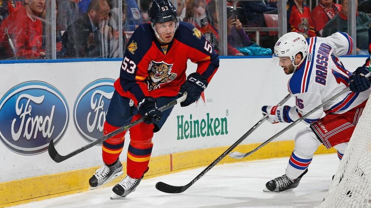 Florida Panthers forward Corban Knight (53) clears the puck while being pursued by New York Rangers center Derick Brassard (16) during the second period Saturday, Jan. 2, 2016, in Sunrise, Fla.