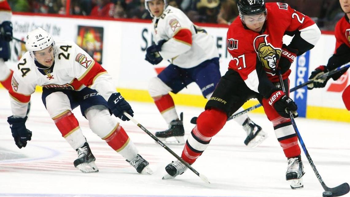 Florida’s Seth Griffith attempts to poke check Ottawa’s Curtis Lazar last Saturday night.
