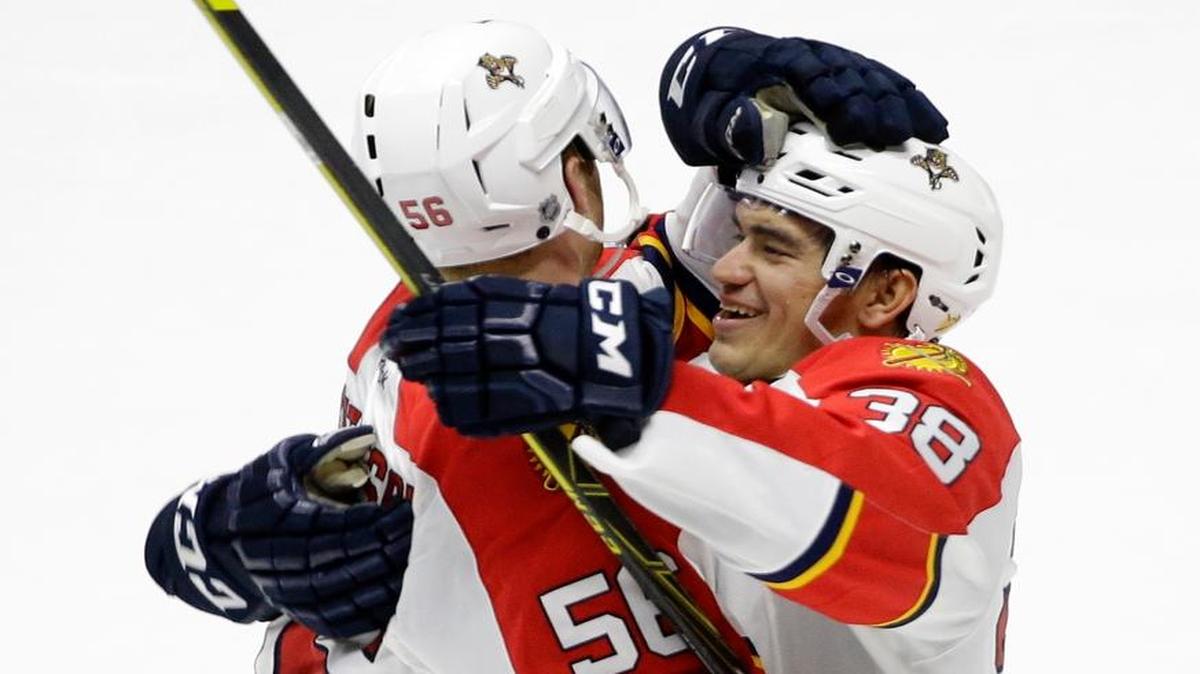 Florida Panthers defenseman Michael Matheson (56) celebrates with forward Shane Harper (38) after Matheson scored against the Nashville Predators in the overtime period of a preseason NHL hockey game Sunday, Sept. 20, 2015, in Nashville, Tenn. The Panthers won in overtime 3-2.