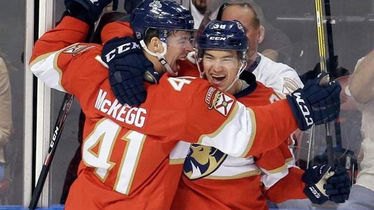 Greg McKegg celebrates with Shane Harper after Harper scored his first of two goals in Florida’s 5-2 win over visiting Colorado on Oct. 22.