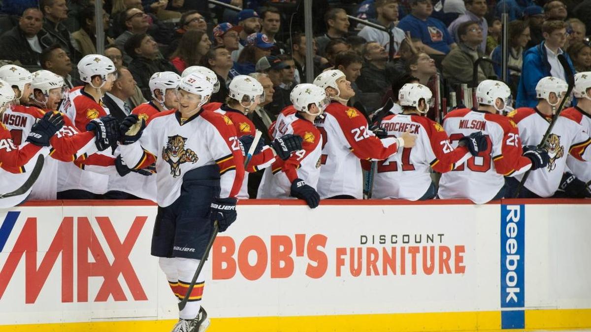 Florida Panthers center Nick Bjugstad (27) celebrates a goal with his teammates in the second period of an NHL hockey game against the New York Islanders in New York, Monday, March 14, 2016.
