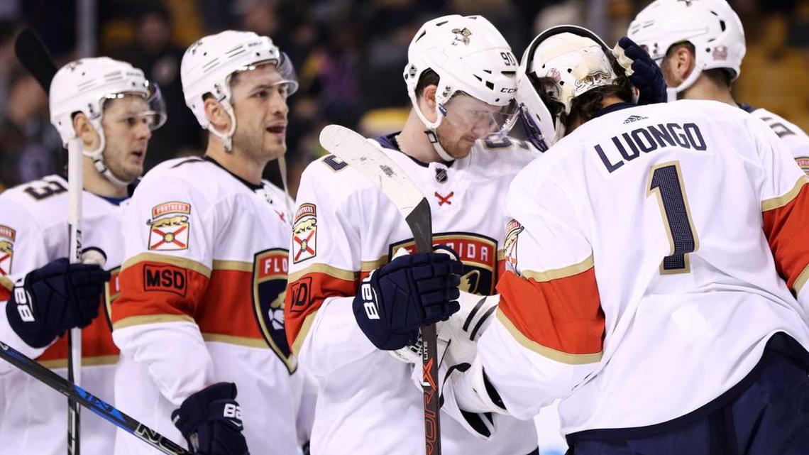 Jared McCann (90) of the Florida Panthers celebrates with Roberto Luongo (1) after the Panthers defeated the Boston Bruins 4-2 at TD Garden on April 8, 2018 in Boston, Massachusetts.