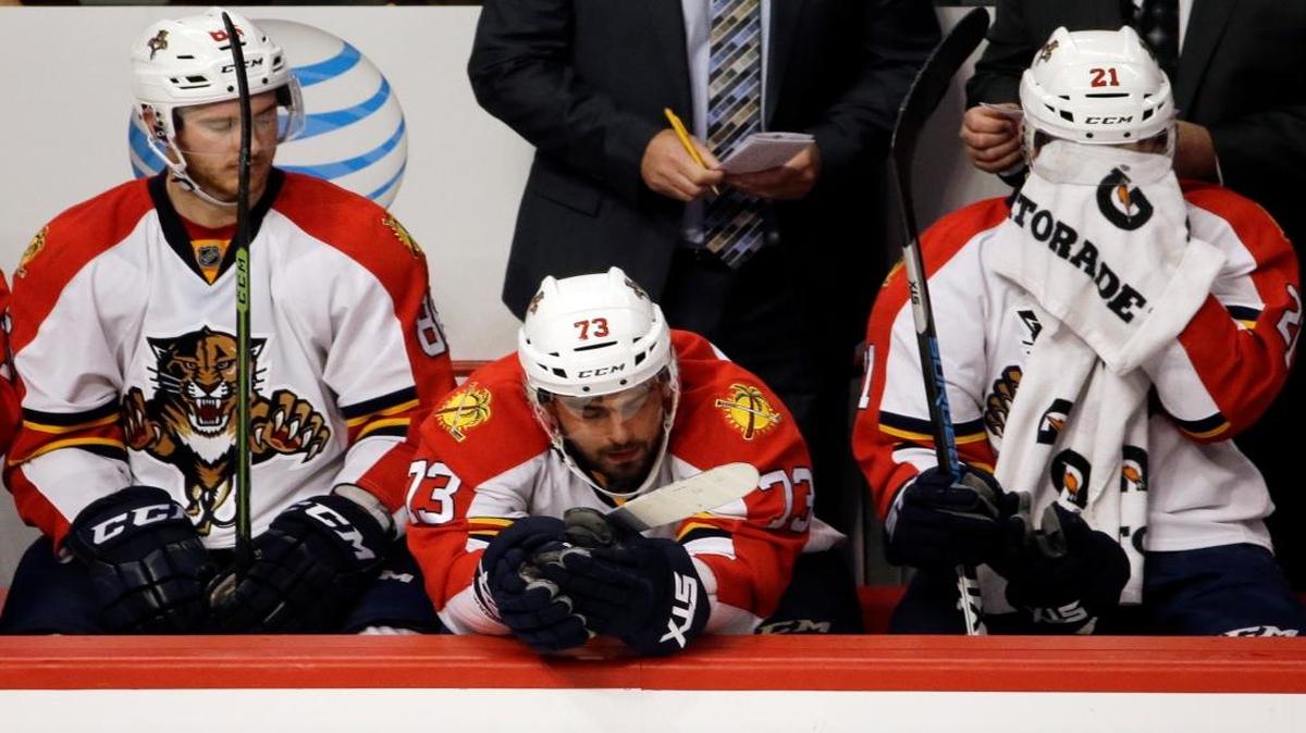 Florida Panthers center Connor Brickley, left, center Brandon Pirri, center, and center Vincent Trocheck react as they watch teammates during the third period of an NHL hockey game against the Chicago Blackhawks, Thursday, Oct. 22, 2015, in Chicago. The Blackhawks won 3-2.
