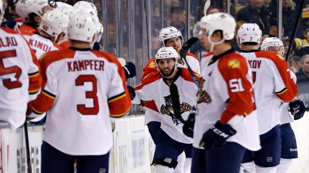 Panthers center Vincent Trocheck, center, celebrates his goal against Boston on Thursday night with teammates.