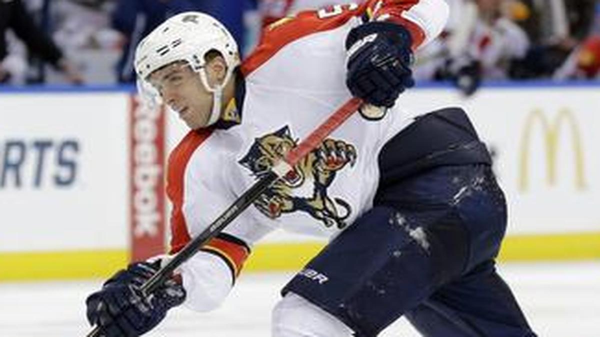 
Florida Panthers defenseman Aaron Ekblad (5) shoots against the Tampa Bay Lightning on Thursday, Oct. 9, 2014, in Tampa, Fla.
